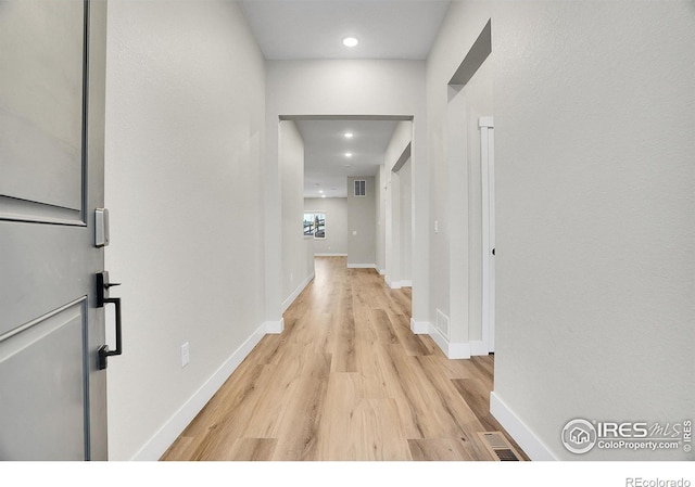 hallway with light wood-type flooring