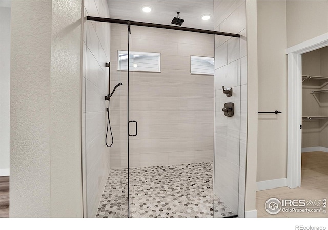 bathroom featuring an enclosed shower