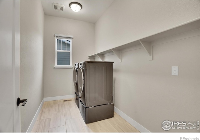 washroom featuring washer and dryer