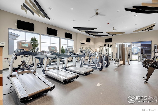 exercise room with ceiling fan