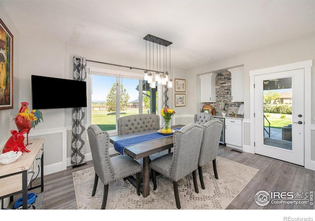 dining room with dark hardwood / wood-style floors