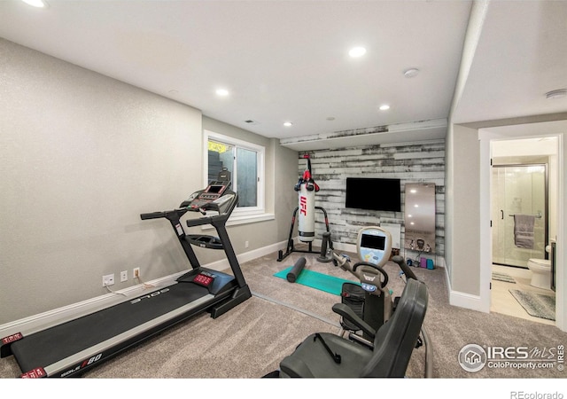 workout room featuring light colored carpet