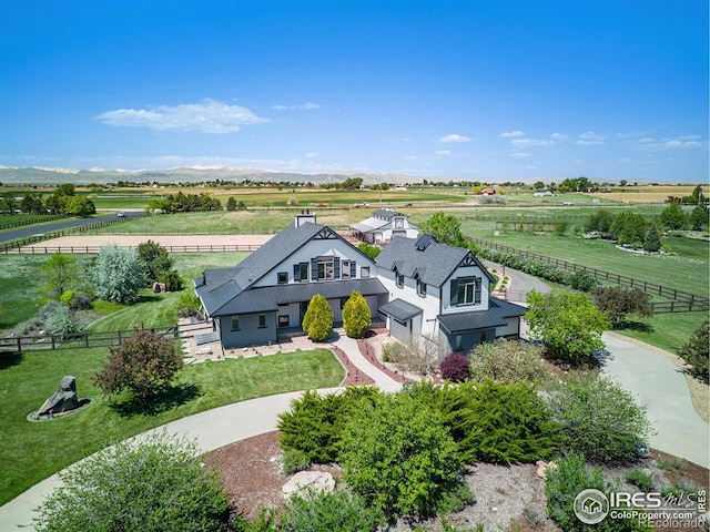 bird's eye view with a mountain view and a rural view