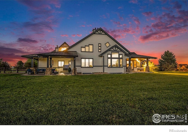37001 Soaring Eagle Cir, Severance, CO 80550 - rear view of house with a standing seam roof, a patio, a metal roof, and covered porch