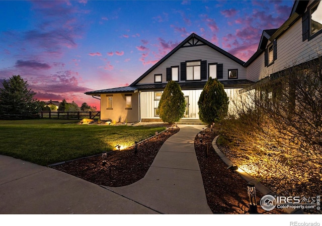 view of front of house with a lawn