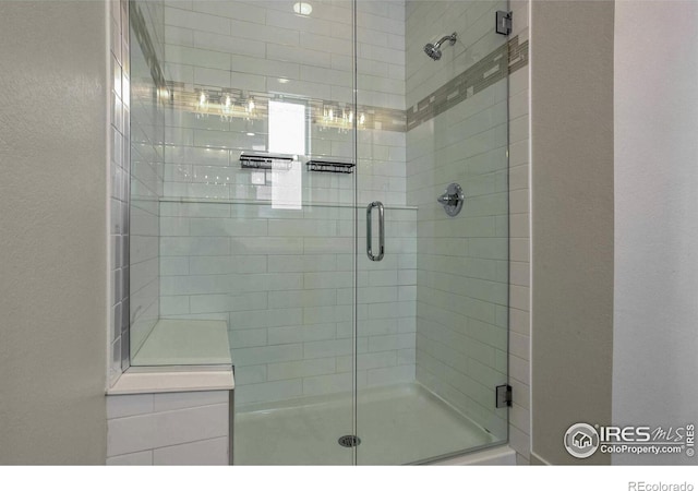 bathroom with a shower with shower door