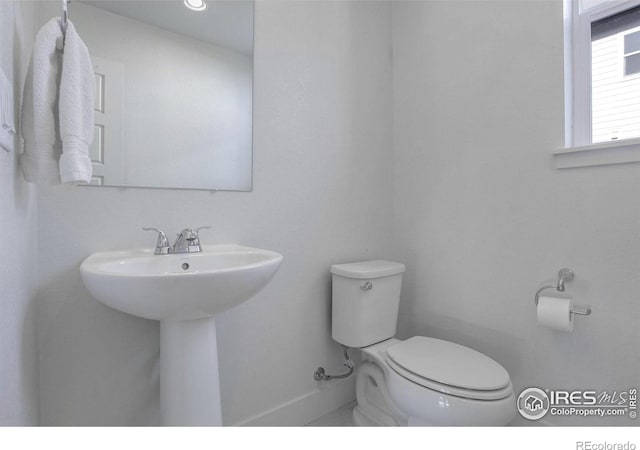 bathroom with toilet and sink