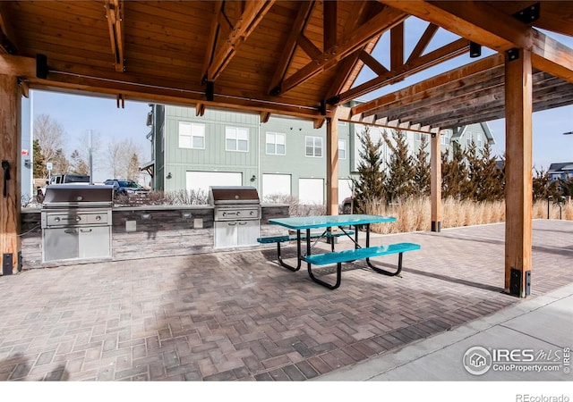 view of patio / terrace with a gazebo, area for grilling, and a grill