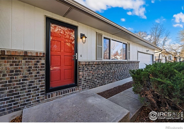 view of exterior entry featuring a garage