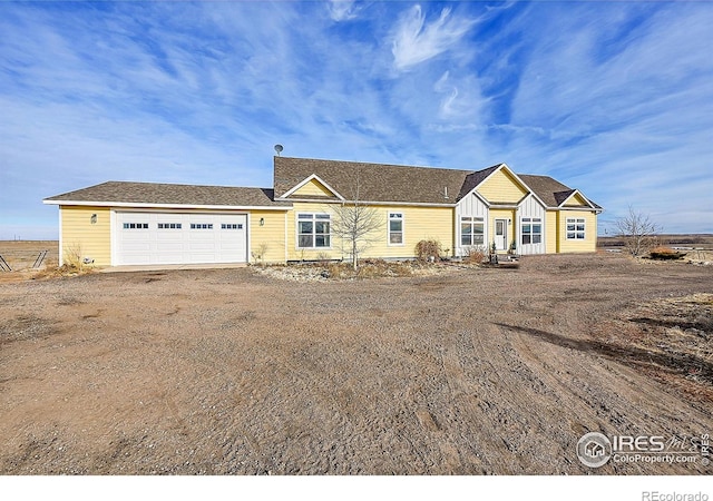 single story home featuring a garage