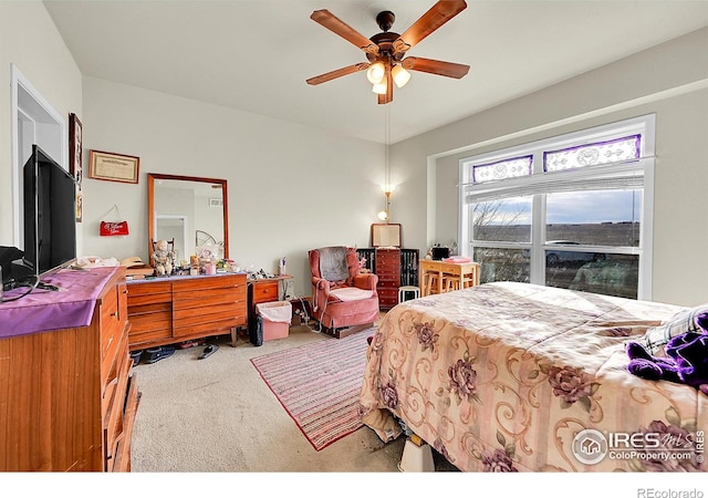 bedroom featuring light carpet and ceiling fan