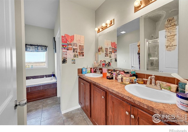 bathroom with vanity, tile patterned floors, and independent shower and bath