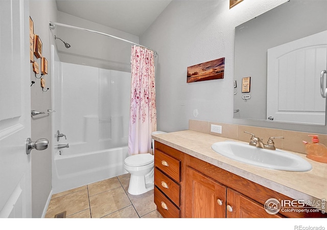 full bathroom featuring tile patterned floors, vanity, toilet, and shower / tub combo with curtain