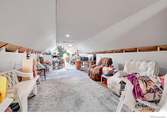 interior space featuring carpet and vaulted ceiling