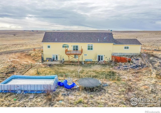 back of house with a patio