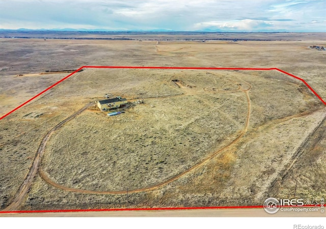 birds eye view of property with a rural view