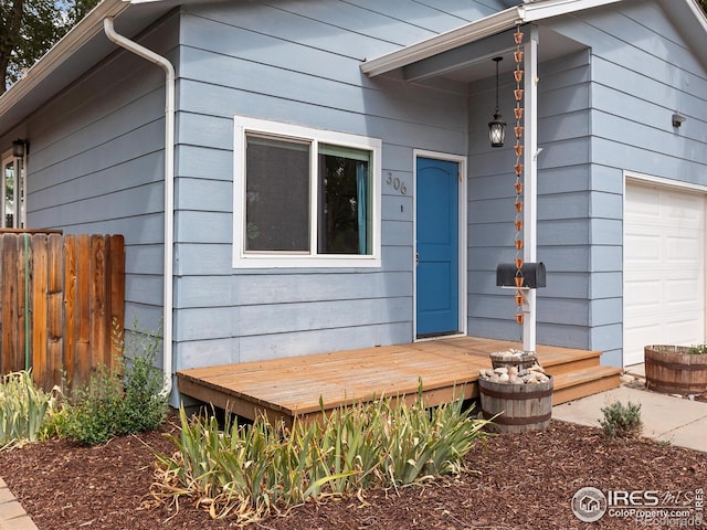 doorway to property featuring a garage