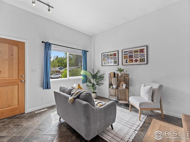 living room featuring track lighting