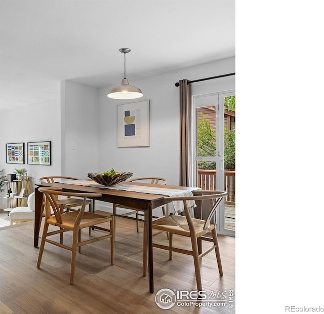 dining space featuring hardwood / wood-style floors