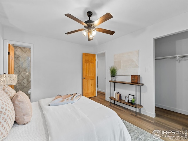 bedroom with connected bathroom, ceiling fan, a closet, and dark hardwood / wood-style floors