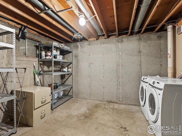 basement with washer and clothes dryer