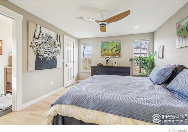 bedroom with hardwood / wood-style flooring and ceiling fan