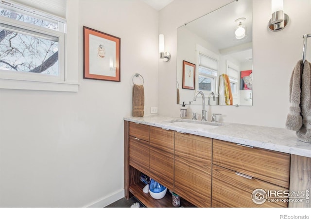 bathroom featuring vanity and a healthy amount of sunlight