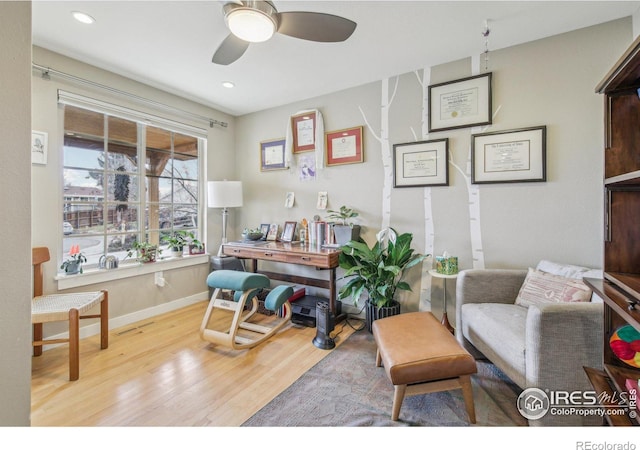 office featuring light wood-type flooring and ceiling fan