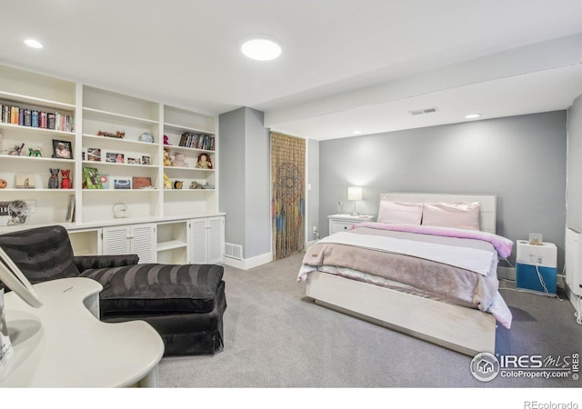 bedroom with light colored carpet