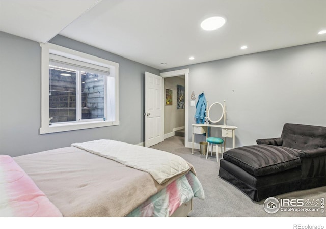 bedroom featuring light carpet