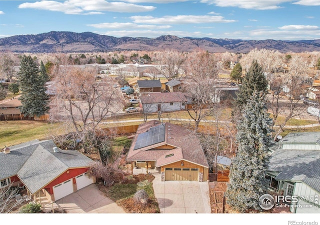 birds eye view of property featuring a mountain view