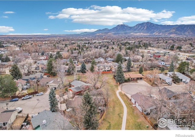 birds eye view of property with a mountain view