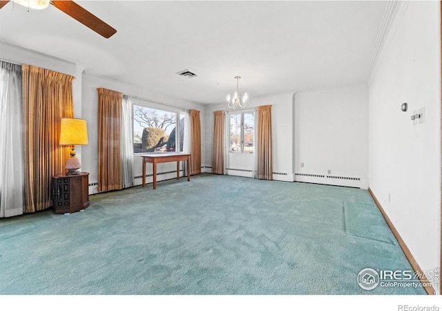 carpeted spare room featuring ceiling fan with notable chandelier and ornamental molding