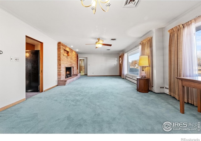 unfurnished living room featuring a baseboard heating unit, ceiling fan with notable chandelier, ornamental molding, a large fireplace, and carpet floors