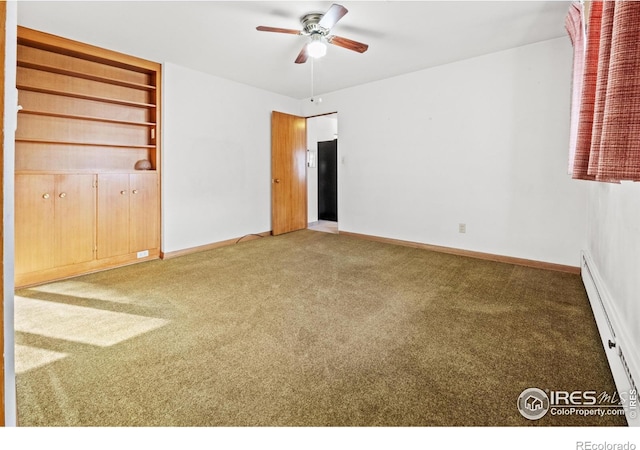 carpeted spare room featuring ceiling fan and baseboard heating