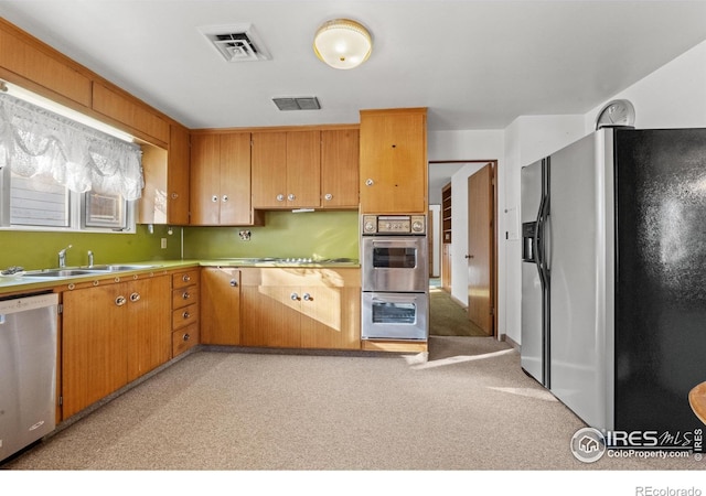 kitchen featuring sink and appliances with stainless steel finishes