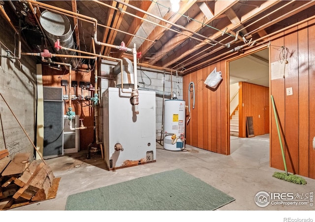 utility room featuring heating unit and water heater