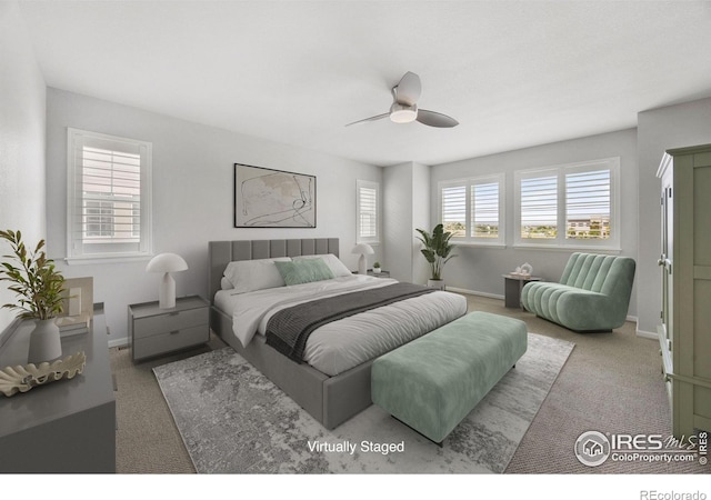 bedroom featuring ceiling fan and carpet floors