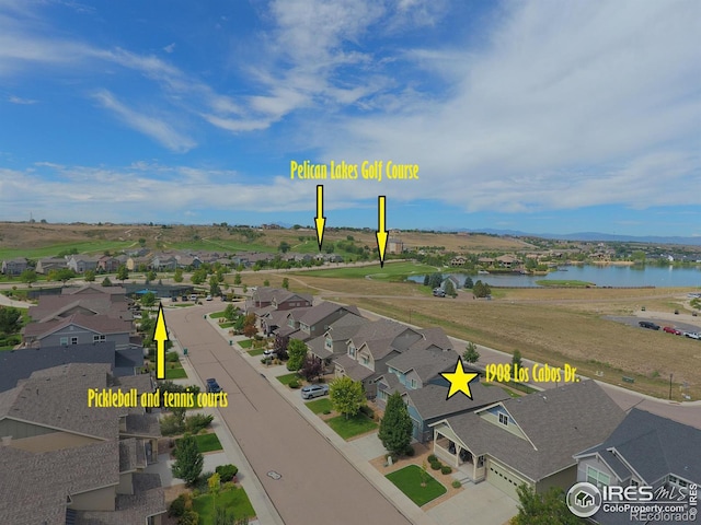 birds eye view of property featuring a water view