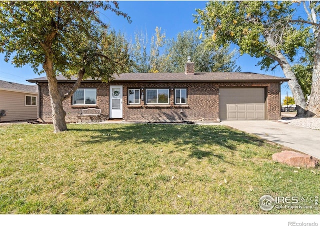 ranch-style home featuring a garage and a front lawn