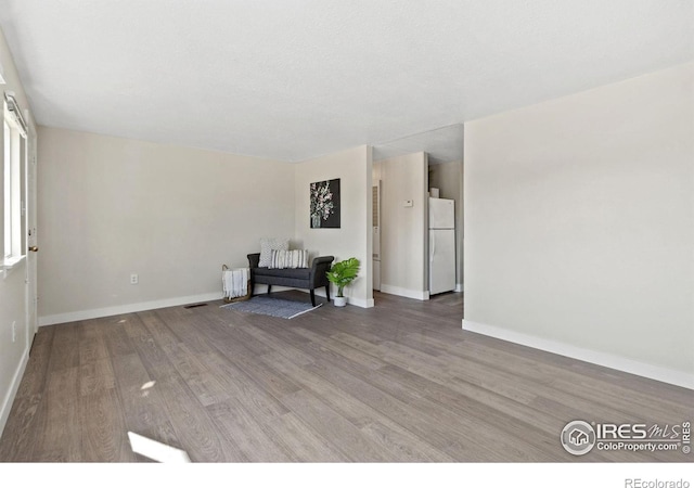 spare room with hardwood / wood-style flooring