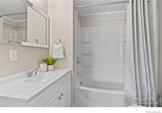 bathroom with shower / bath combo with shower curtain and vanity