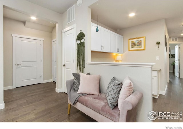 living room with dark hardwood / wood-style flooring