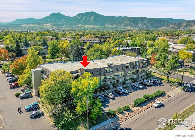 birds eye view of property with a mountain view