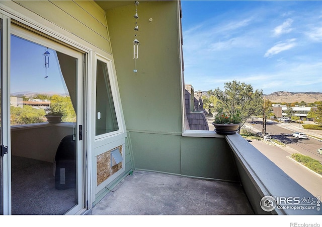 balcony featuring a mountain view