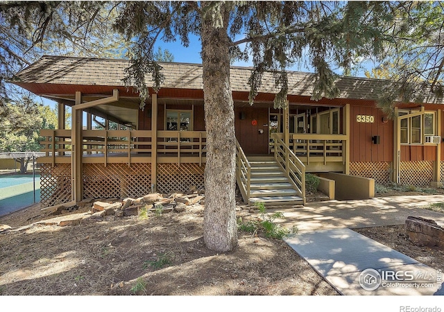 view of front of home featuring stairway and board and batten siding