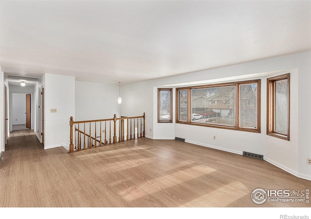 unfurnished room featuring light hardwood / wood-style floors