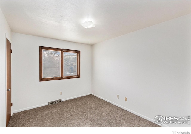 empty room with carpet flooring