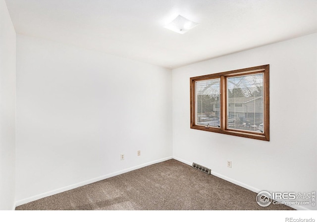 unfurnished room featuring carpet flooring