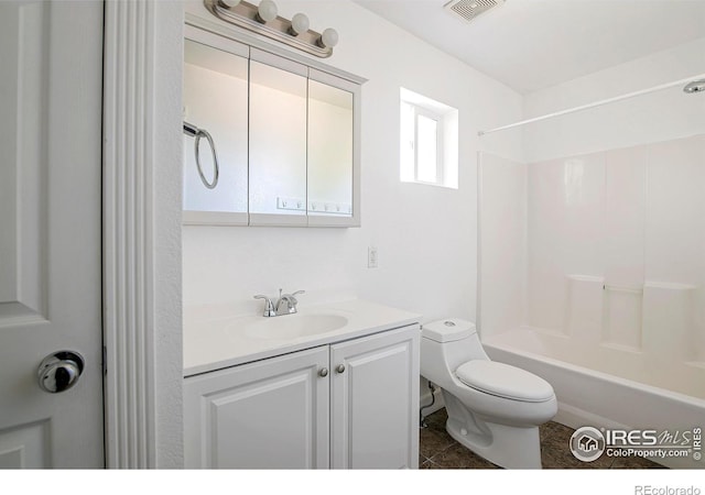 full bathroom with shower / tub combination, vanity, and toilet